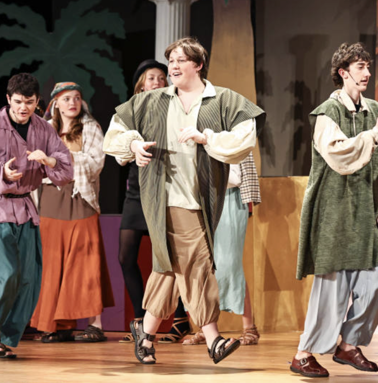 Brendan Lobo performs on stage as Levi, one of Joseph's brothers